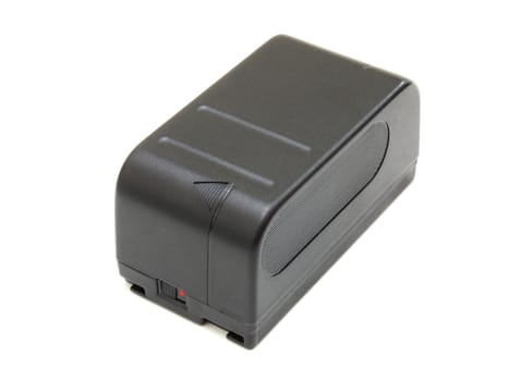 The black small rectangular accumulator from a videocamera on a white background