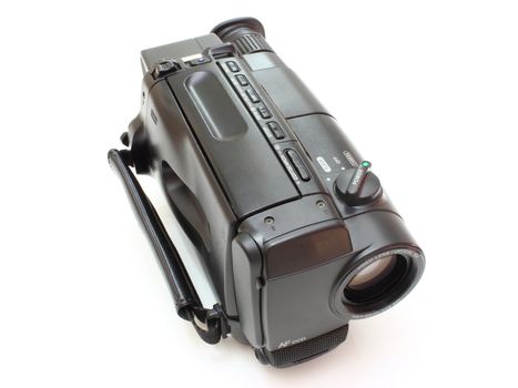 Black videocamera with buttons and switches on a white background