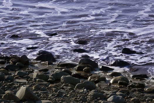 tide coming over the stones