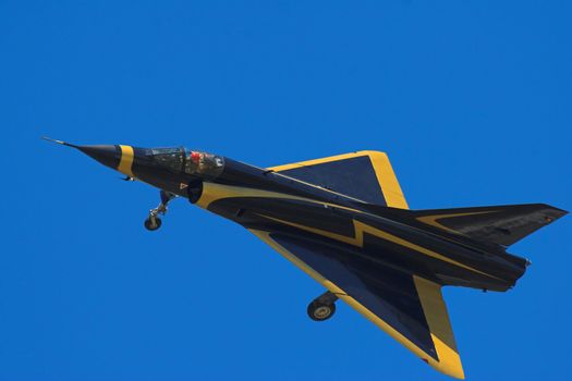 Mirage III jet with its landing gear out