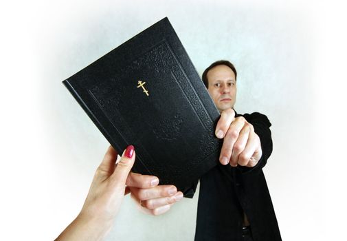 The man transfers the woman the bible