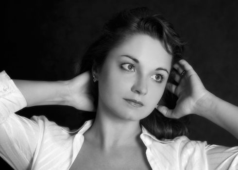 Portrait of the beautiful woman in studio