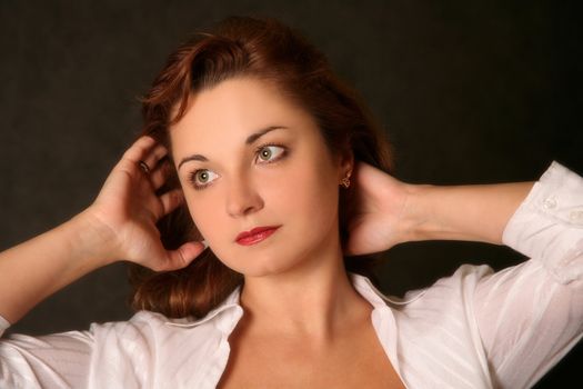 Portrait of the beautiful woman in studio