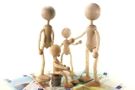 a family of wooden dolls and Euro notes