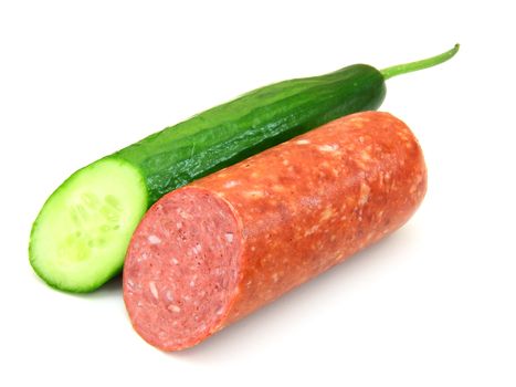 Fresh sausage and cucumber lie nearby on a white background