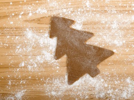 Baking homemade Gingerbread cookies with a shape of a christmas tree