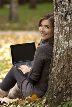 Beautiful woman working with a laptop in outdoor