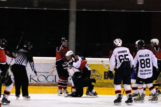 ZELL AM SEE, AUSTRIA - MARCH 19: Salzburg hockey League. Fight between Herbert Wierer and Salzburg player. Game SV Schuettdorf vs Salzburg Sued  (Result 10-4) on March 19, 2011, at the hockey rink of Zell am See.