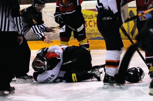 ZELL AM SEE, AUSTRIA - MARCH 19: Salzburg hockey League. Fight between Herbert Wierer and Salzburg player. Game SV Schuettdorf vs Salzburg Sued  (Result 10-4) on March 19, 2011, at the hockey rink of Zell am See.