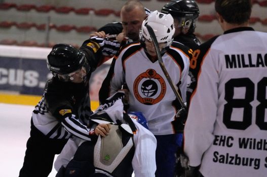 ZELL AM SEE, AUSTRIA - MARCH 19: Salzburg hockey League. Fight between Markus Ralser and Salzburg player. Game SV Schuettdorf vs Salzburg Sued  (Result 10-4) on March 19, 2011, at the hockey rink of Zell am See.