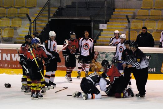 ZELL AM SEE, AUSTRIA - MARCH 19: Salzburg hockey League. Fight between Markus Ralser and Salzburg player. Game SV Schuettdorf vs Salzburg Sued  (Result 10-4) on March 19, 2011, at the hockey rink of Zell am See.