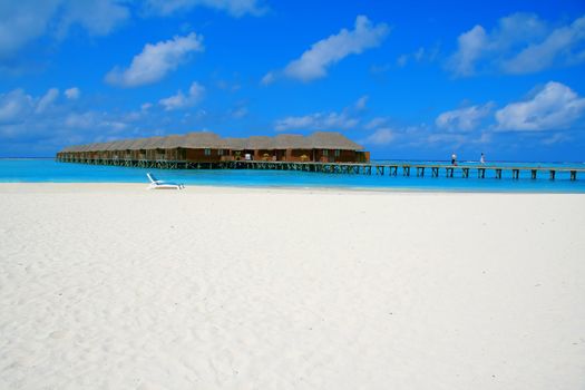 Water villas and turquoise water on Meeru Island, Maldives