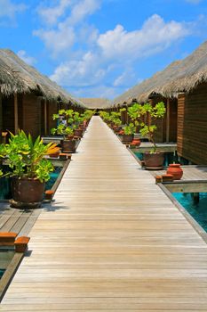 Water villas and turquoise water on Meeru Island, Maldives