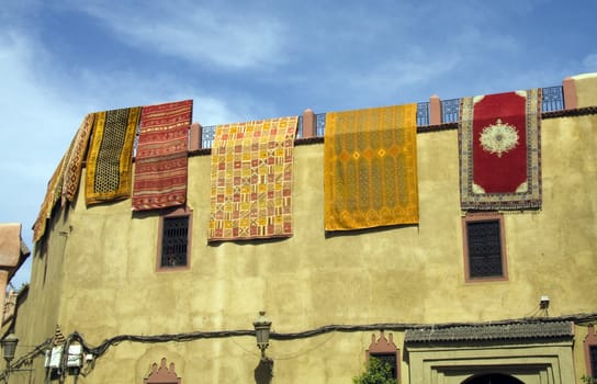 Carpets hanging from wall, Marrakech, Morocco