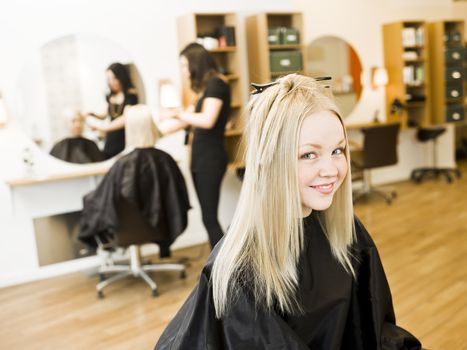 Young Blond Girl in the Hair Salon