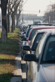 Cars parking in a line on an urban street