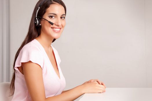 A female on a hands free phone - friendly call center