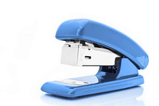 Close up of a single blue office stapler isolated over white