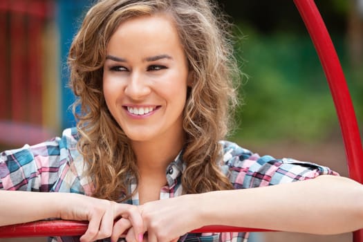 Happy young female looking away and smiling outdoors