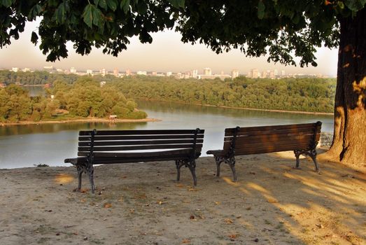 two wooden benches in Kalemegdan park, view on Sava and Danube rivers