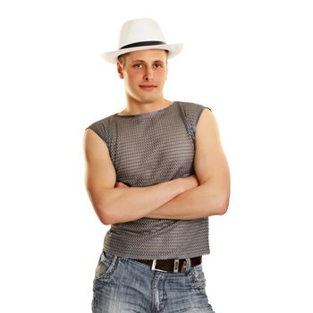 A young man in a T-shirt, jeans and a hat isolated on white background