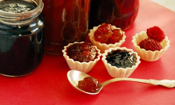 preserves,  jam in small edible treats and glass jars
