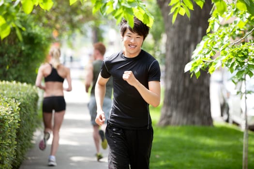 Portrait of a man running against blur background