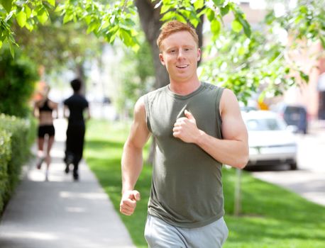 Close-up of man running against blur background