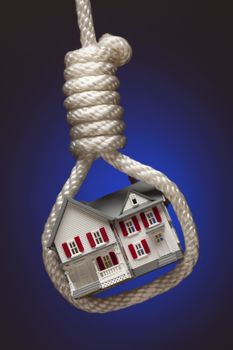 House Tied Up and Hanging in Hangman's Noose on Blue Background.