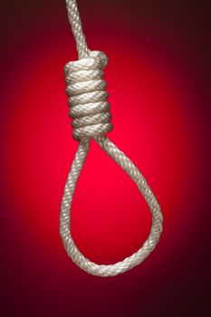 Hangman's Noose Over Red Spot Lit Background.