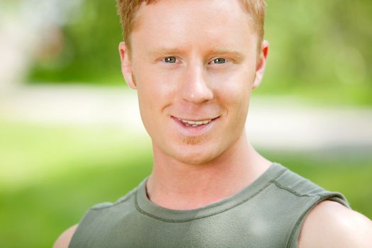 Portrait of a Caucasian man smiling against blur background