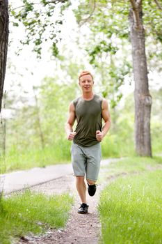 Man jogging during morning time in a park