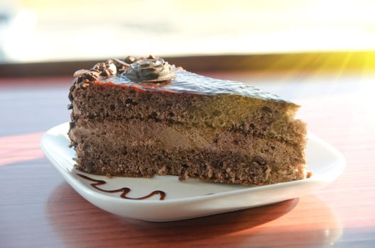 piece of chocolate cake at white plate