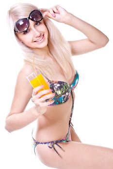 beautiful women in swimsuit with a glass of juice on a white background isolated