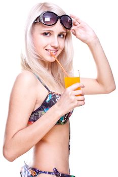 beautiful women in swimsuit with a glass of juice on a white background isolated