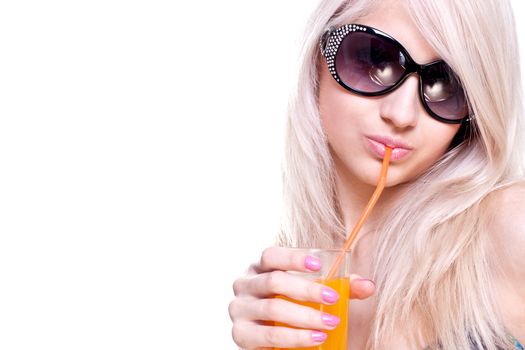 beautiful women in swimsuit with a glass of juice on a white background isolated