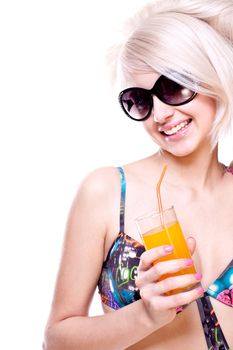 beautiful women in swimsuit with a glass of juice on a white background isolated