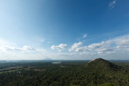 Sky above small mountains, covered with trees. Sri Lanka