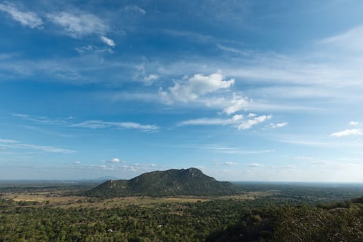 Sky above small mountains, covered with trees. Sri Lanka