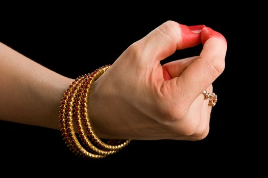 Woman hand showing Trilinga hasta of indian classic dance Bharata Natyam