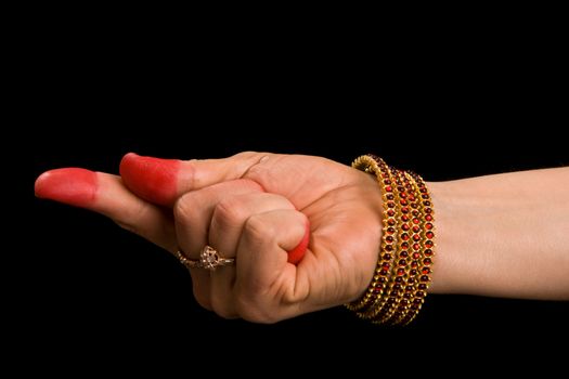 Woman hand showing Suuchi hasta (meaning "Needle") of indian classic dance Bharata Natyam