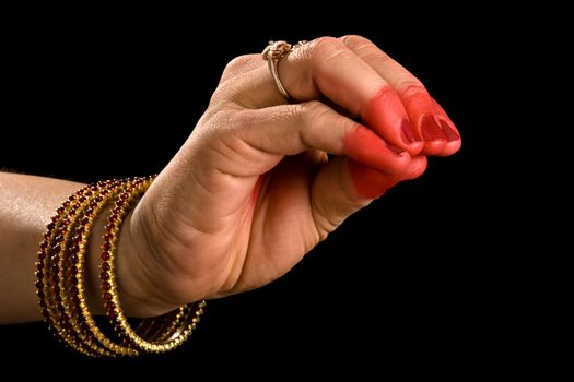 Woman hand showing Mukula hasta (hand gesture, also called mudra) (meaning "lily") of indian classic dance Bharata Natyam. Also used in other indian classical dances Kuchipudi and Odissi.