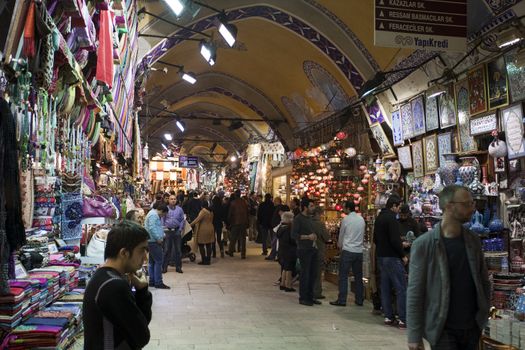 ISTANBUL - MARCH 19: People shopping in the Grand Bazaar. This is one of the largest and oldest covered markets in the world. March 19, 2011 in Istanbul, Turkey.