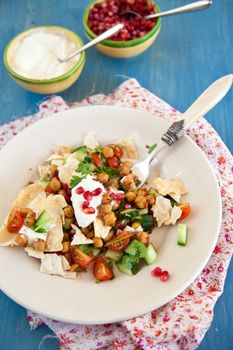 Delicious salad with fresh pomegranate and chickpeas