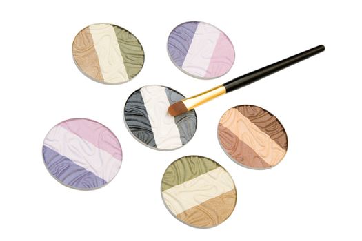 Make-up brush and powder eye shadows isolated on white background
