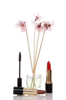 cosmetics, parfume and flower on white background