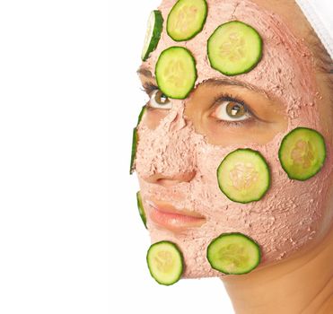  Beautiful young woman with a facial mask. facial care concept