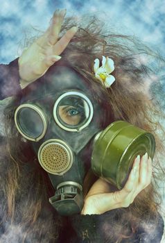  a girl posing in a gas-mask 