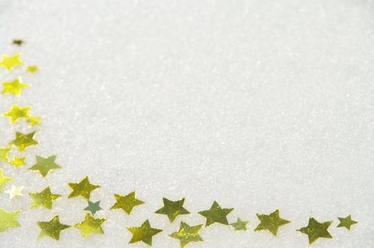 golden snow stars on a real snowy icy surface