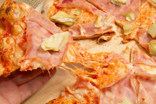 pizza on wooden cutting board